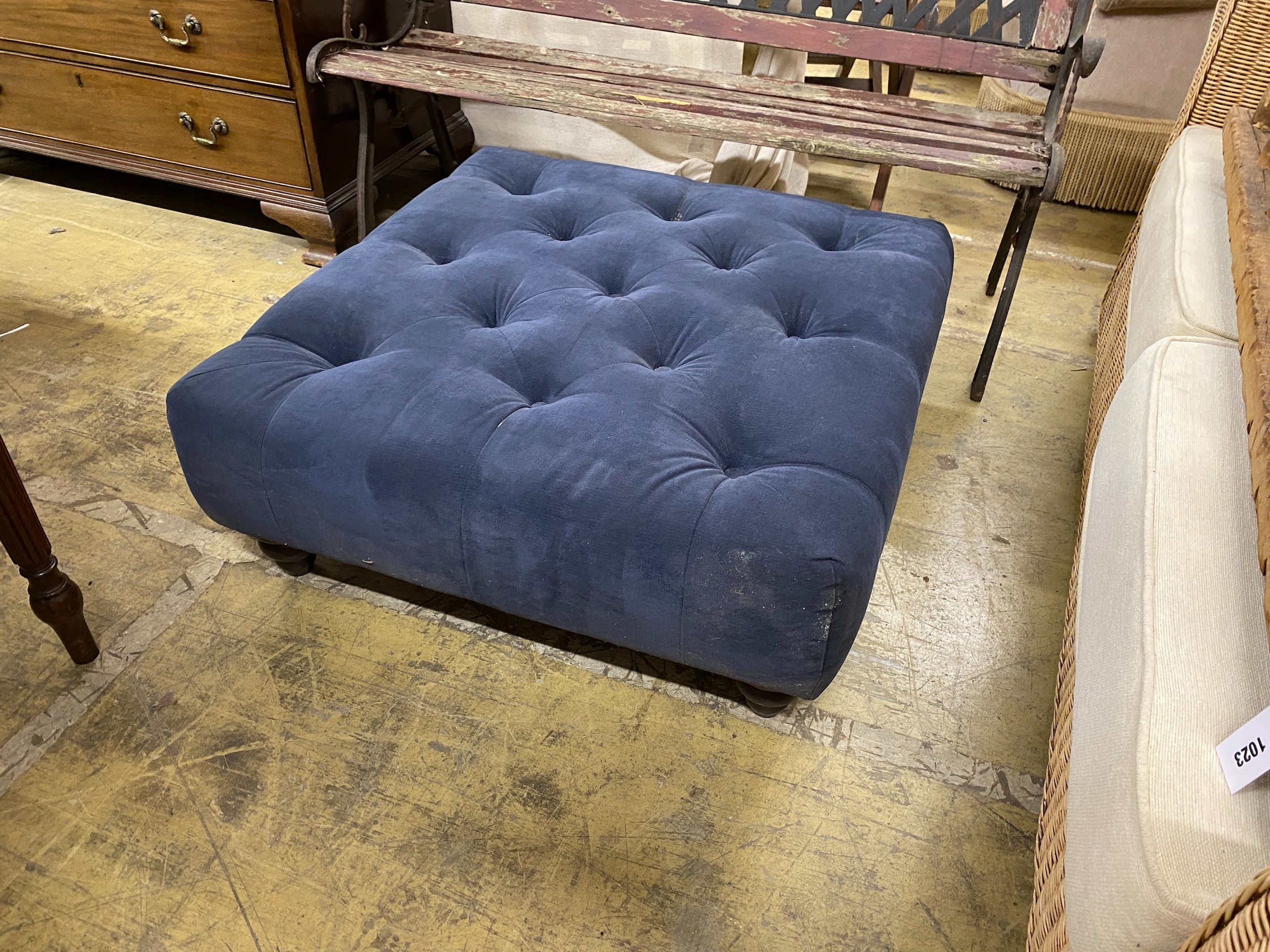 A contemporary buttoned blue fabric footstool, 80cm square, 33cm high